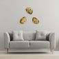 Preview: Three golden wall lights in a group above the couch