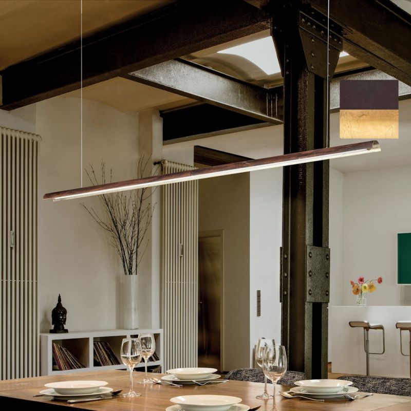 Narrow long Tile pendant light above the dining table in dark brown and gold leaf