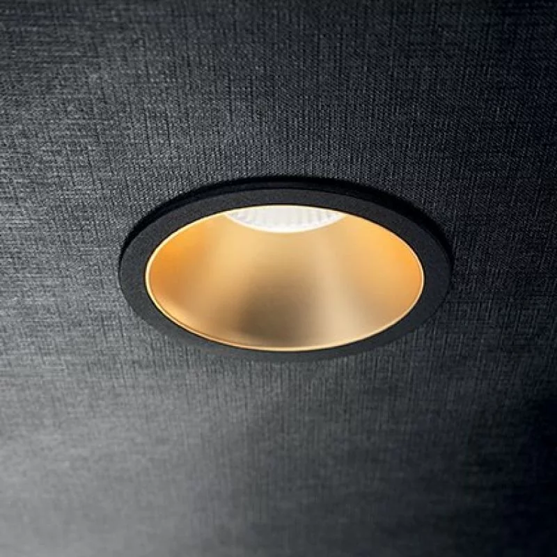 Recessed ceiling light outside in black, inside in gold matt